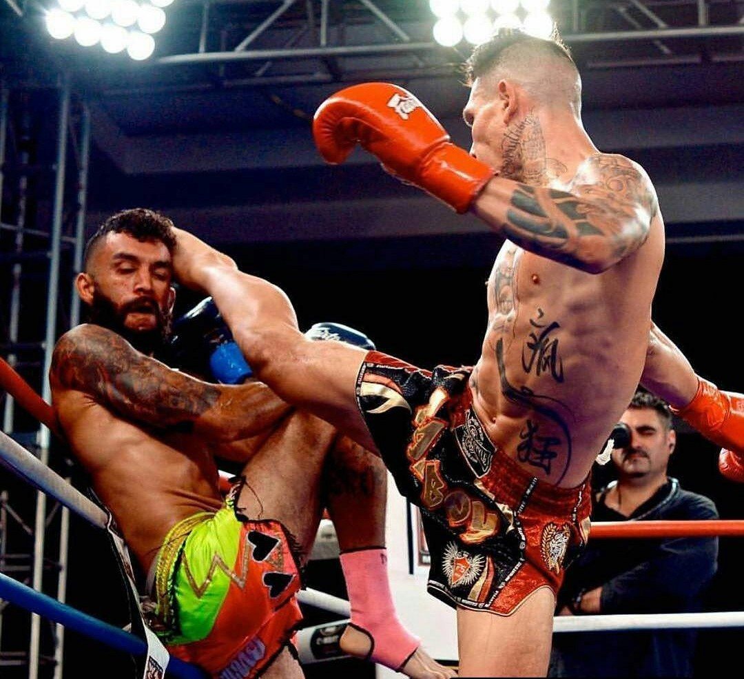 Founder landing a head kick in competition